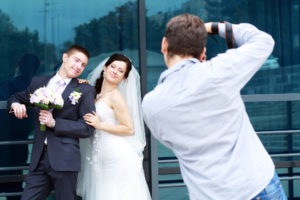 Couple posing for wedding photographs
